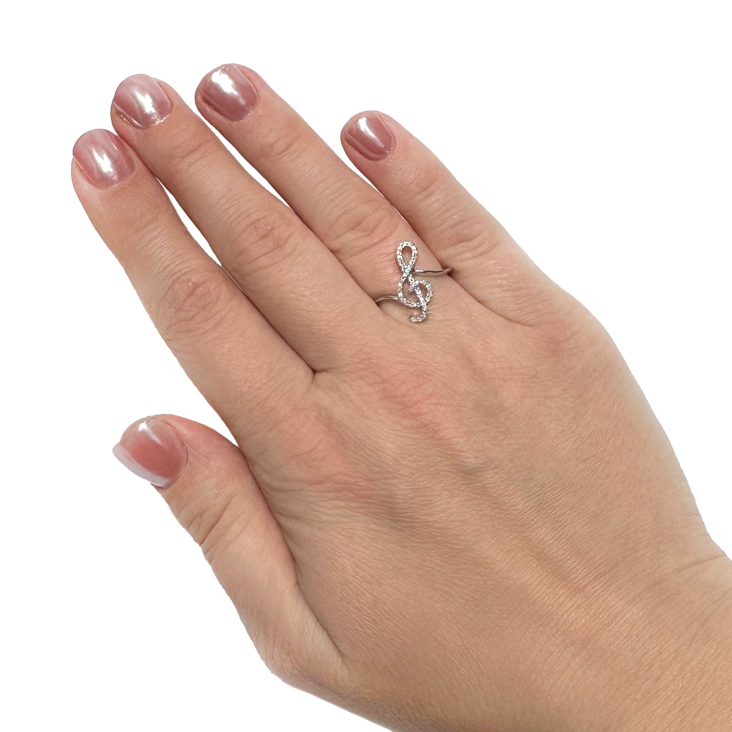 Hand wearing a silver ring with a treble clef design on a white background [lifestyle]