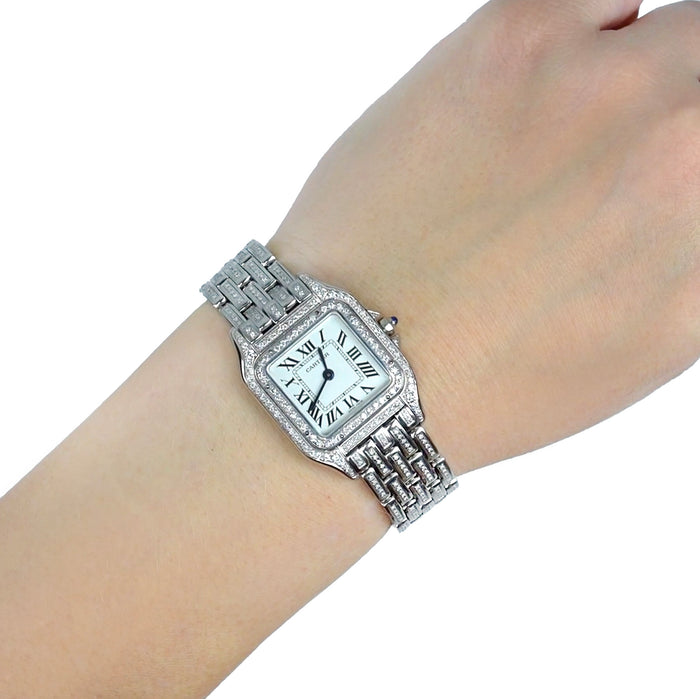 Silver watch on a wrist with a white background [lifestyle]