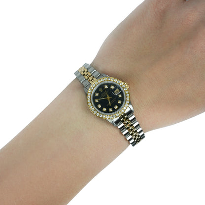 Gold and silver watch on a wrist with a white background [lifestyle]