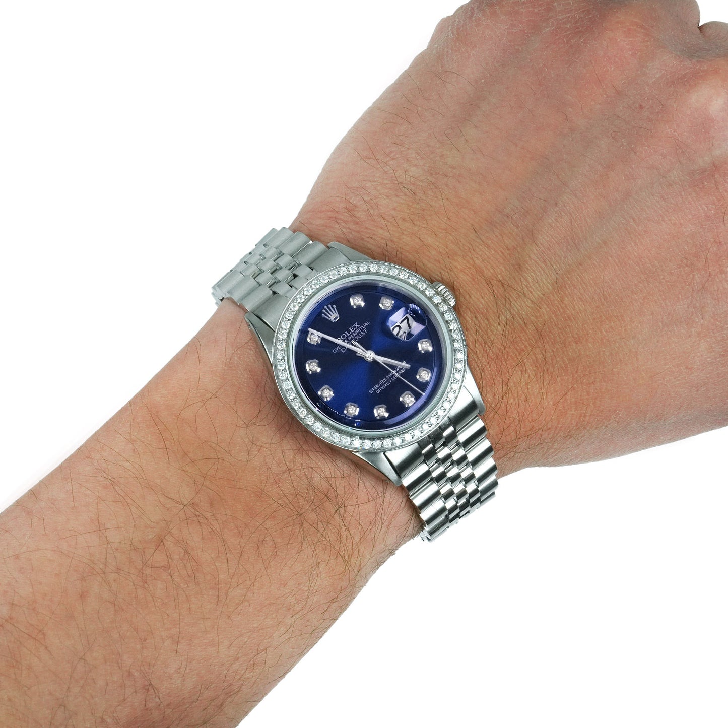 Silver watch with a blue face on a wrist against a white background [lifestyle]
