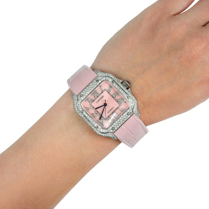 Pink watch with decorative case on a wrist against a white background [lifestyle]