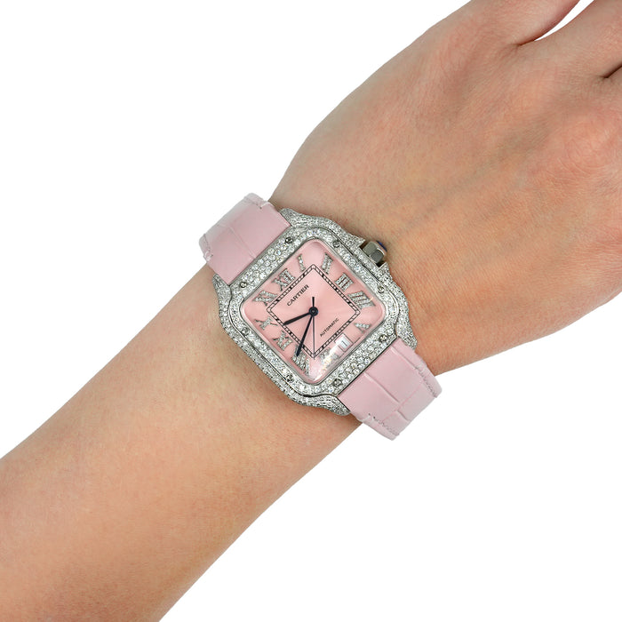 Pink watch with decorative case on a wrist against a white background [lifestyle]