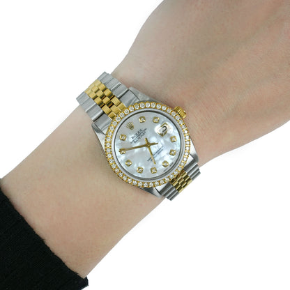Two-tone watch with a gold and silver band on a wrist against a white background [lifestyle]