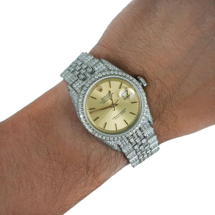 Luxury watch with diamond-studded band on a wrist against a white background [lifestyle]