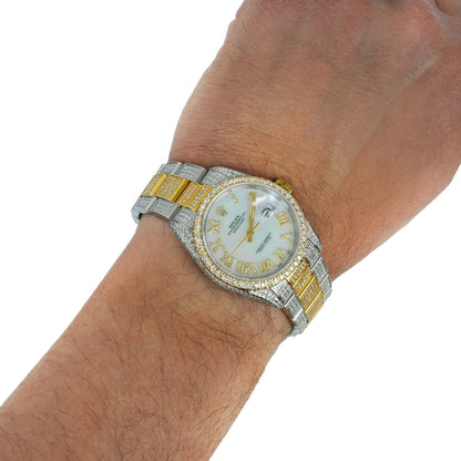 Luxury watch with a silver and gold band on a wrist against a white background [lifestyle]