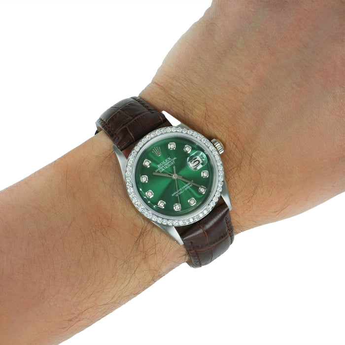 Green watch with brown leather strap on a wrist against a white background [lifestyle]