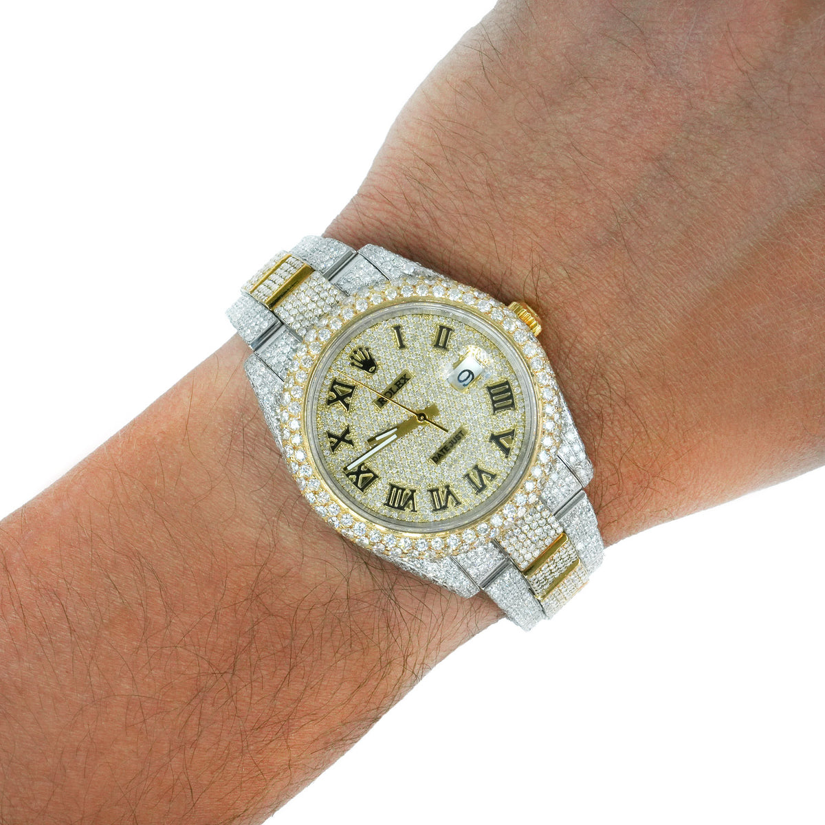 A luxury watch with a diamond-encrusted silver-tone bracelet and gold-tone accents, shown worn on a person's wrist against a white background. [lifestyle]