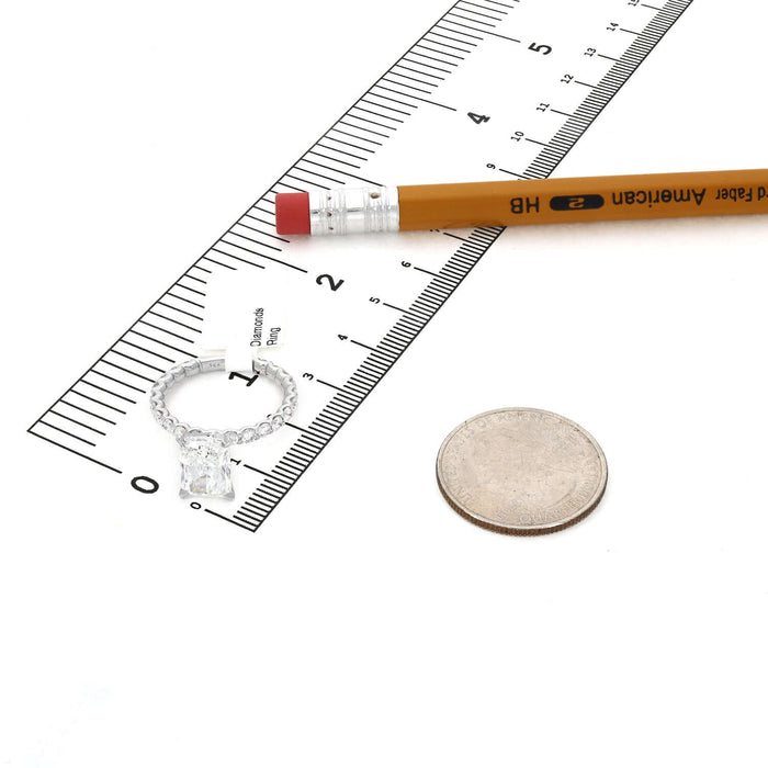 3.90TCW Lab-Grown Radiant-Cut Diamonds 14k White Gold Engagement Ring beside a ruler and a coin for size reference.