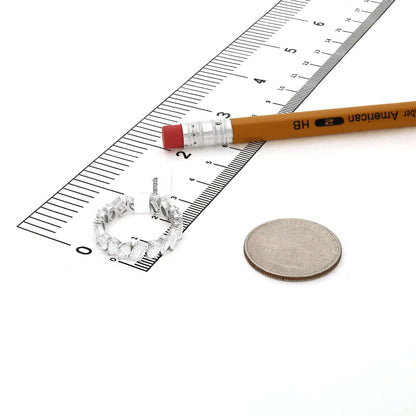 4.66 TCW Lab-Grown Diamond 14K White Gold Eternity Band next to a ruler and a coin for size reference.
