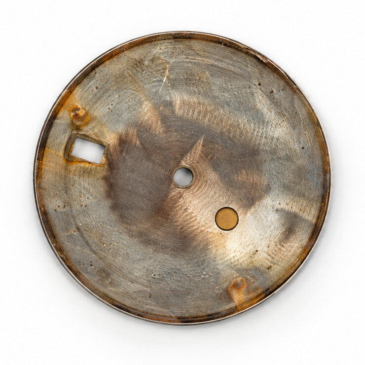 Reverse of champagne Rolex Datejust dial showing surface wear
